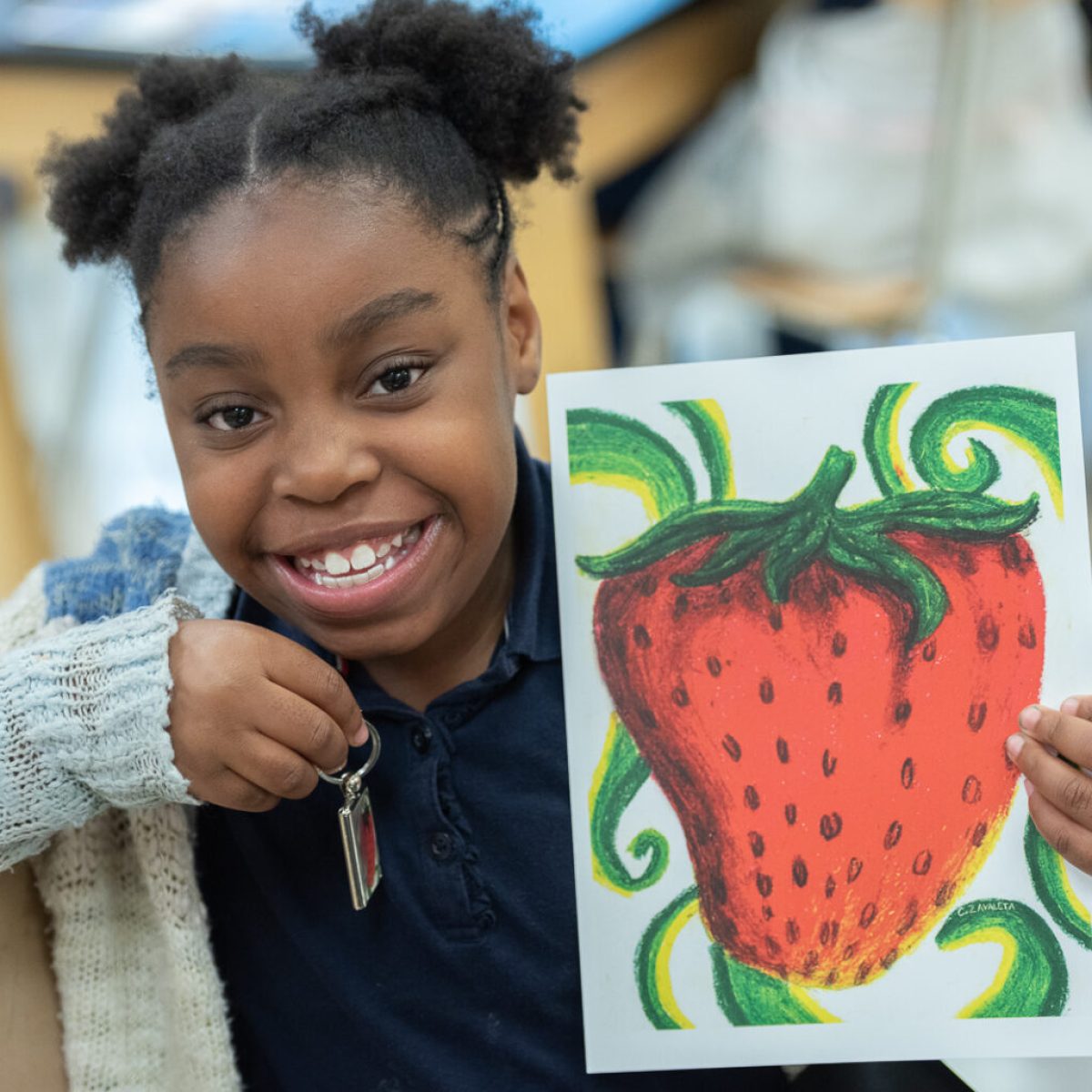 Contact Art to Remember with questions about an Art Fundraiser for Schools image shows student with strawberry artwork